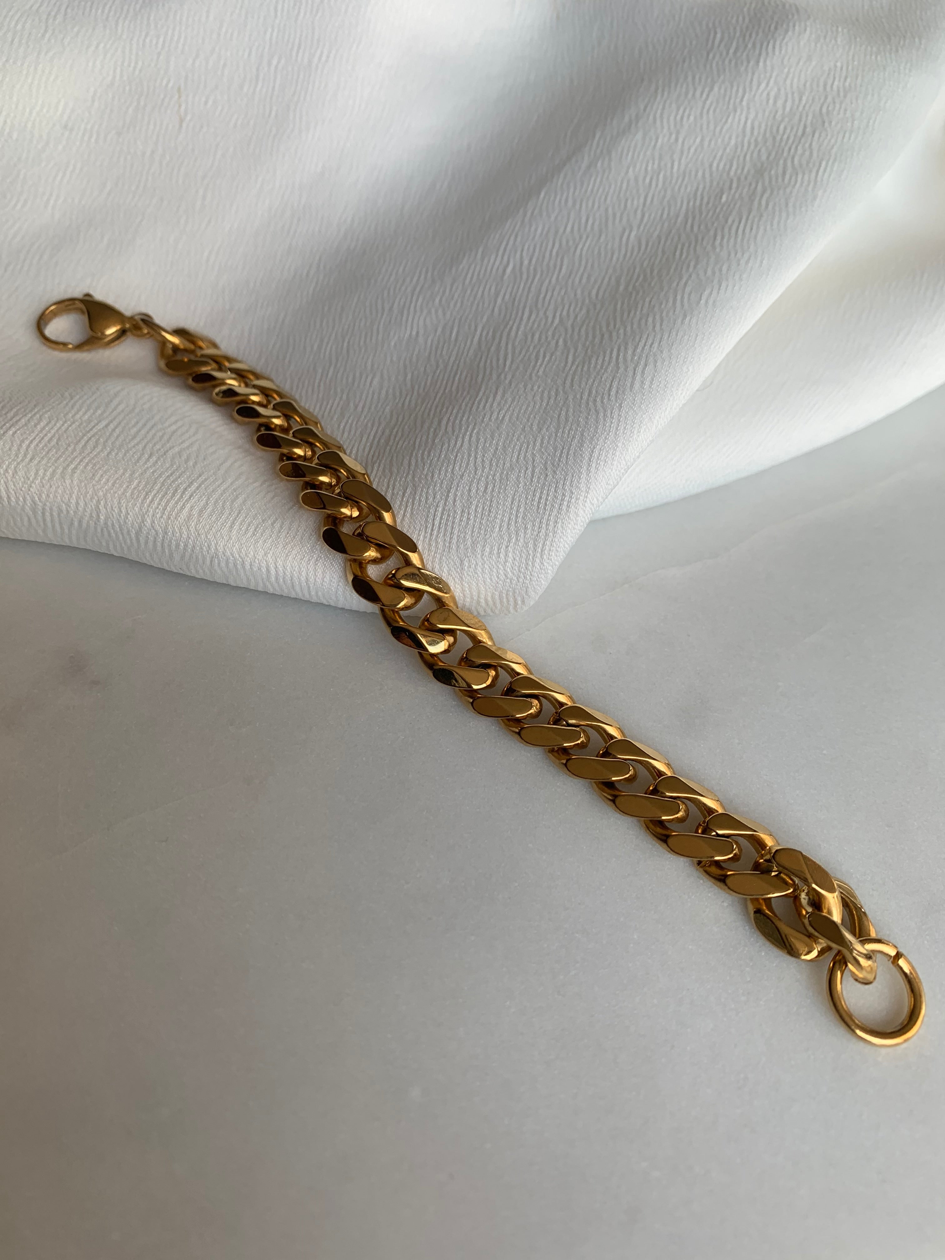 Trendy & bold, this thick curb chain will stand out in any stack! 14K Gold Plated Hypoallergenic Tarnish Resistant 11mm thick, 18cm length | The Thick Curb Bracelet | Non-tarnish 14k Jewellery EasyClubCo