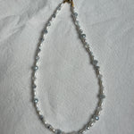 white & silver pearl necklace